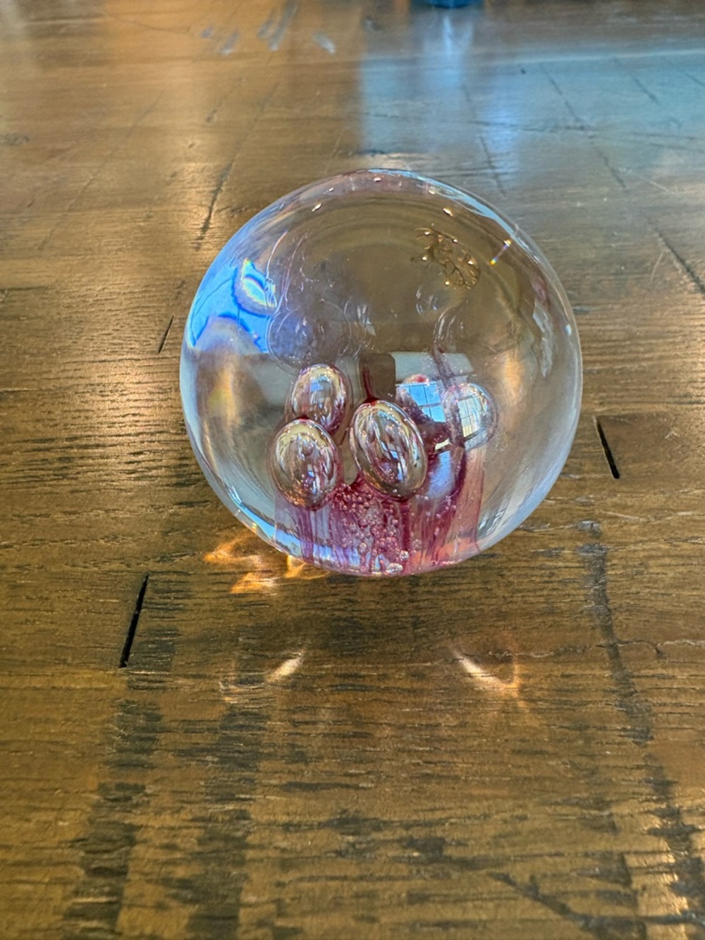 Strombergshyttan studioglas. 2.75” Clear Glass Paperweight with Pink Bubbles.
